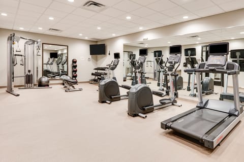 Fully equipped fitness center with cardio and strength training equipment.