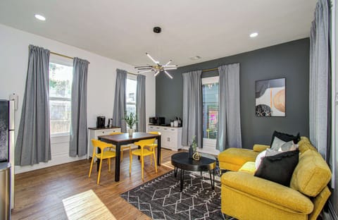 Bright, modern retreat with bold accents, cozy lounge seating, and café-style dining—perfect for relaxing in style.