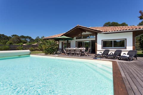 Have fun splashing around in the outdoor pool by your villa!
