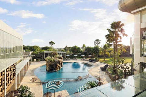 Outdoor pool, open 7:00 AM to 7:00 PM, pool umbrellas, sun loungers