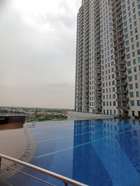 Outdoor pool, open 6:00 AM to 9:00 PM, lifeguards on site