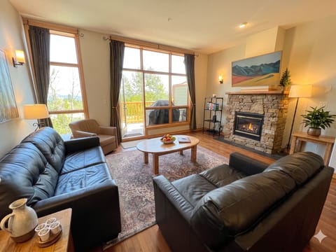 Cozy Living area with pull-out double sofa bed, Gas Fireplace, and Smart TV with Cable. Walk out to the main floor BBQ deck.