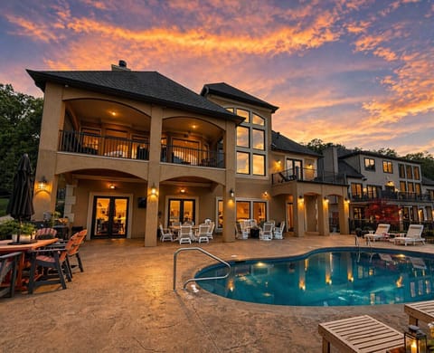 Upscale lakefront villa with private pool, spacious patios, and panoramic sunset views—ideal for large group getaways at Lake of the Ozarks.