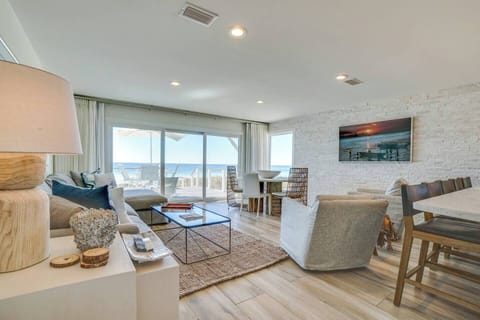 Relax in your coastal living room where ocean breezes, natural textures, and stunning sea views blend seamlessly into your home.
