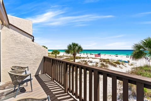 Picture yourself unwinding on your private balcony, soaking in stunning turquoise waters and soft white sand just steps away—your beachfront escape awaits.