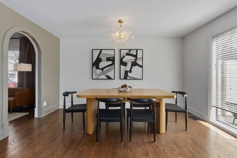 Gather around the expandable dining table, with additional chairs available for 