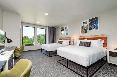 Unwind by the window with treetop views and airy comfort.