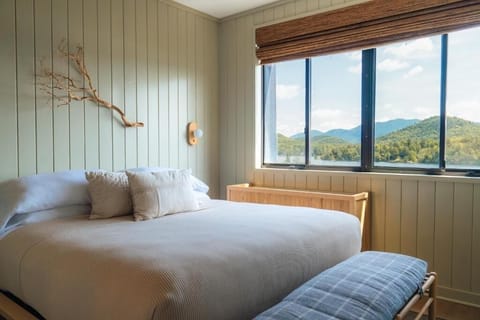 Wake up to mountain views from this serene king bed.