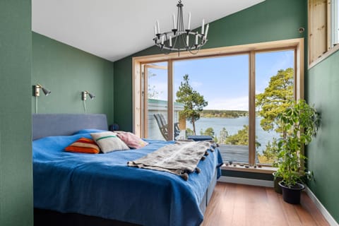 Master bedroom on the third floor with stunning views of the Stockholm archipelago