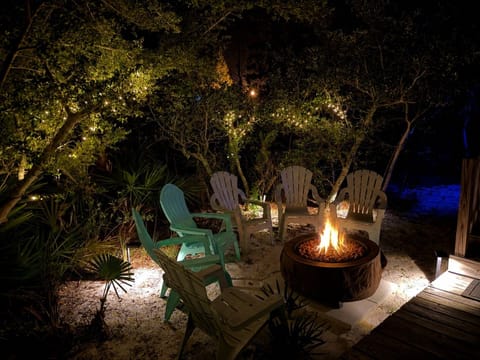 Charming fire pit lounge with twinkle lights for cozy nights outdoors