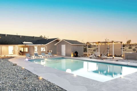 Features Olympic size swimming pool. Backyard also features fire pit, hot tub, and hammocks for stargazing, BBQ and outdoor dining - All on 5 beautiful and private acres.