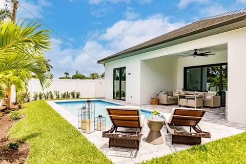 Soak up the Florida sunshine from your private pool oasis, complete with loungers and a shaded outdoor living area.