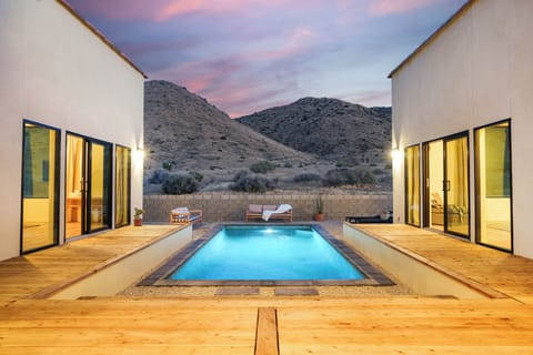 Welcome to your desert oasis—a modern retreat with a private pool and panoramic mountain views.