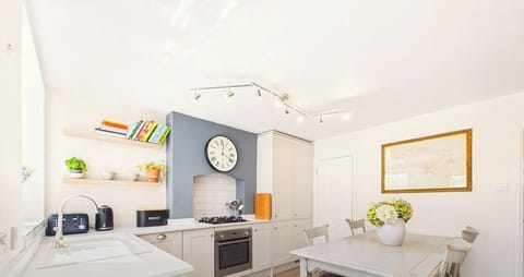 The heart of the cottage: a bright kitchen-diner where breakfast stretches on and the kettle is never far away.