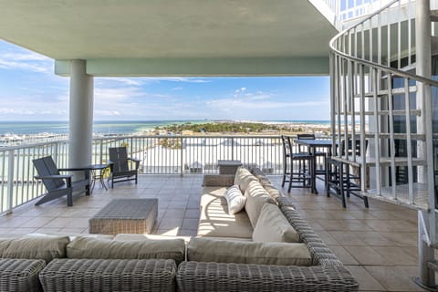Unwind on your spacious waterfront terrace with plush seating and sweeping views—perfect for morning coffee or evening relaxation.