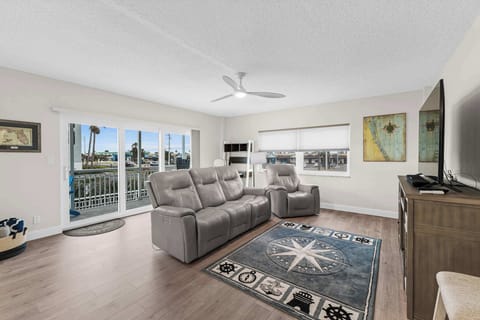 Modern Living Room with Recliner Sofas and Ocean-Blue Rug