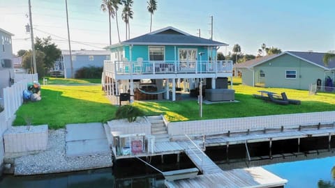 Private waterfront home with 90 ft fishing pier and floating dock offering true direct Gulf access.
