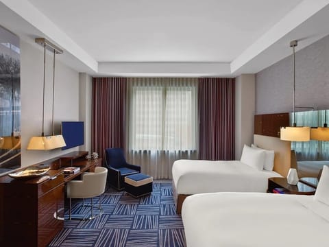 Unwind in a stylish double room with dedicated workspace.