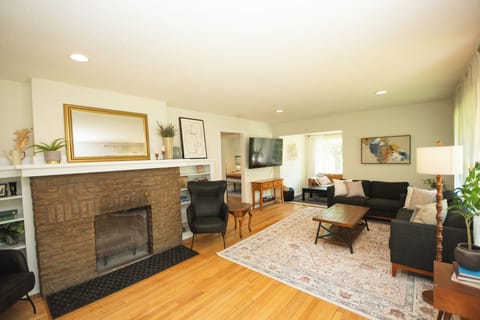 Huge living room with original hardwood floors