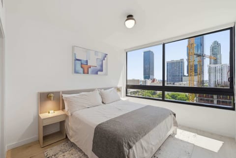 Cozy Bedroom with City Skyline Views