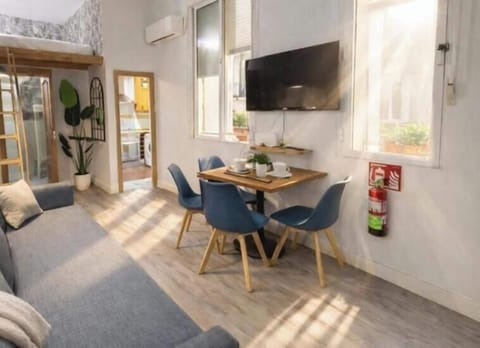 Deluxe Apartment | Living area | 32-inch flat-screen TV with cable channels