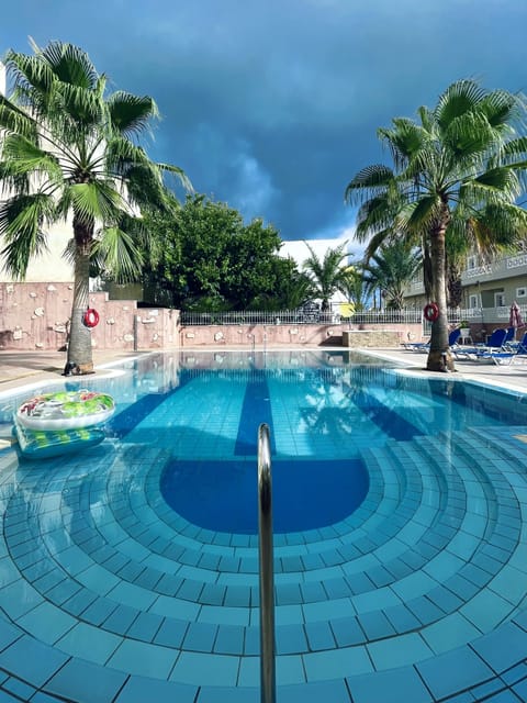 Outdoor pool, open 8:00 AM to 7:00 PM, pool umbrellas, sun loungers