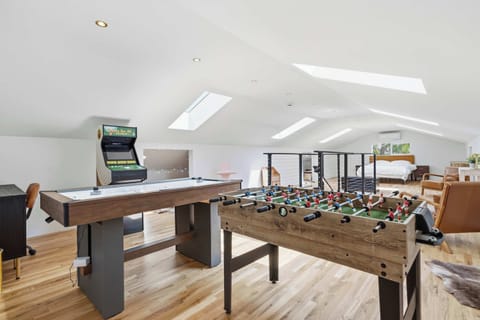 Upstairs Loft — Foosball, Air Hockey & Golden Tee Arcade with Skylights and Bedroom Beyond