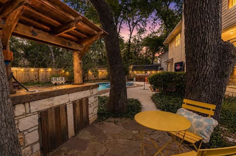  Tuck away under the gazebo with a drink in hand — this cozy stone outdoor bar and bistro seating is your go-to spot for quiet mornings and breezy evenings.
