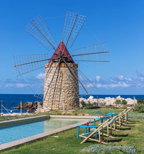 Seasonal outdoor pool, open 11:00 AM to 6:00 PM, pool umbrellas