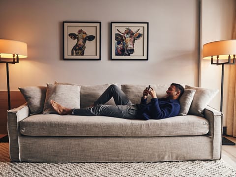 Suite, Balcony, Mountain View | Living area | 32-inch flat-screen TV with cable channels, TV, foosball