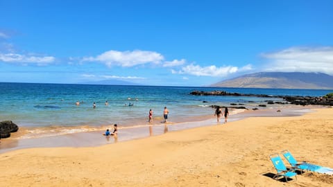 The sugar-sand beach across from Haleakala Shores facing northwest towards the West Maui mountains.