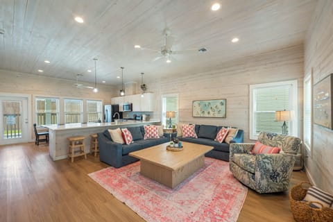 Spacious open concept living, dining and kitchen area.