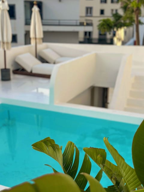 Outdoor pool, open 8:00 AM to 8:00 PM, pool umbrellas, sun loungers
