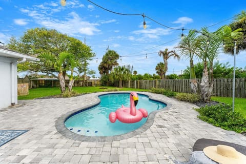Tropical backyard oasis with heated pool