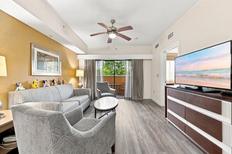 Spacious living room with Smart TV and balcony access