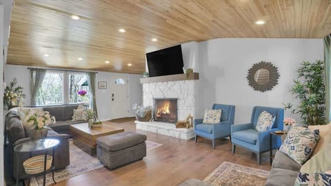 Cozy Living Room with Fireplace & Vaulted Wood Ceilings
