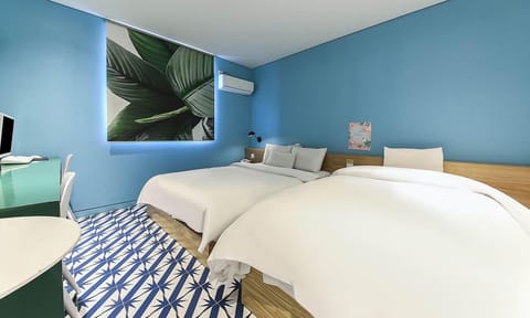 Twin Room | Down comforters, individually decorated, individually furnished