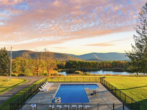 Slightly aerial shot of the pool showcasing the picturesque backdrop.
