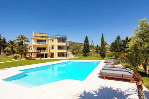 Long afternoons begin beside the private pool, where open sea views, sun loungers, and the villa’s elevated position create an easy outdoor rhythm from morning through sunset.