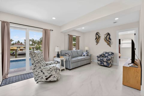 Unwind in the airy living room & stream your favorites on the smart TV​