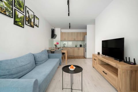 Relax in the stylish living room with a comfortable sofa and modern decor.