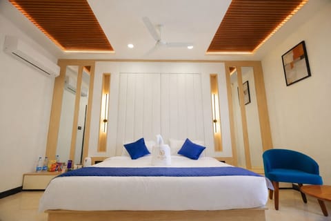 Luxury Suite, Balcony, City View | In-room safe, desk, laptop workspace, blackout drapes