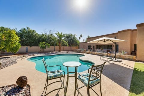 Poolside Lounge | Umbrella Seating | Spacious Outdoor Living