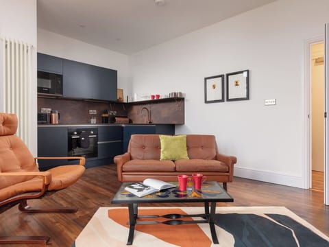 Furniture, Interior Design, Flooring, Floor, Couch, Wall, Room, Wood, Wood Flooring, Living Room