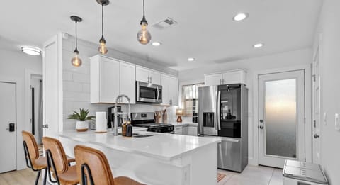 Cook a full meal with modern stainless appliances, ample counter space, and all the cookware you need.