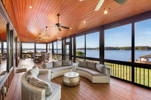 Enjoy stunning big water views from the comfortable lounge seating on the screened porch. 