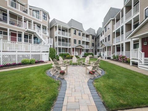 Gather around the fire pit for cozy evenings with friends in this inviting courtyard.