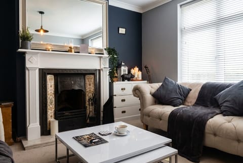 Sink into the chesterfield sofa by the original fireplace with coffee in hand.