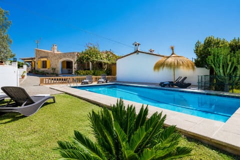 Charming Mallorcan villa with private pool, spacious Mediterranean gardens and outdoor terraces in Pollensa, perfect for relaxing holidays in Mallorca.