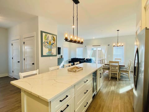 Fully Equipped Kitchen w/ Refrigerator, Oven, Stove, Microwave, Coffee Maker, Cooking Utensils, and Breakfast Bar